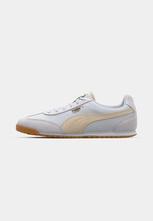 Light blue suede and mesh sneaker with beige accents, lace-up closure, rubber sole, and a golden logo. Features a low-profile design.