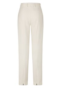Pantalons taillés beiges avec une texture lisse, présentant une fermeture éclair aux chevilles, deux poches arrière et un design à l'avant plat.