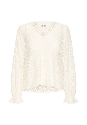 Blusa bianca in pizzo a maniche lunghe con scollatura a V, chiusura con bottoni frontale, motivi a diamante e floreali, e polsini arricciati.