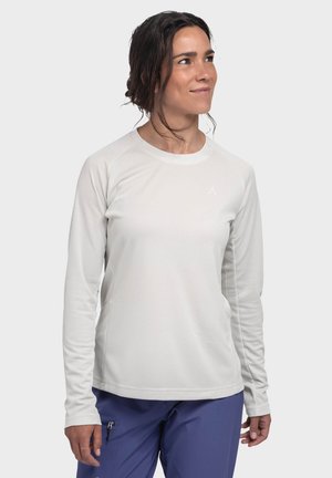 Langärmliges, weißes Funktionsshirt mit strukturiertem Stoff und rundem Halsausschnitt, ausgestattet mit Raglanärmeln und einem kleinen Logo auf der Brust.
