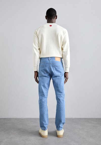 Filippa K CROPPED - Calças de ganga de corte afunilado - blue