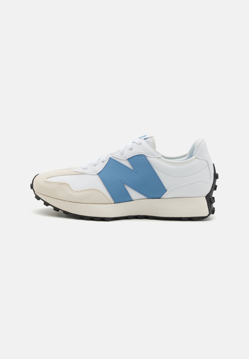 White sneaker with blue accents, featuring a suede and leather upper, rounded toe, black rubber sole, and prominent "N" logo on the side.