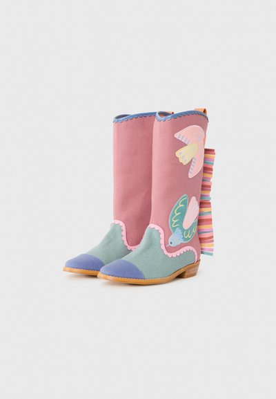 Colorful knee-high boots with pink fabric, scalloped edges, green and blue accents, floral embroidery, and a striped ribbon at the back.