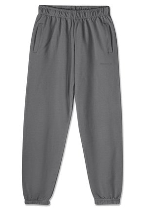 Pantaloni della tuta grigi realizzati in tessuto morbido, con vita elastica, polsini alla caviglia e due tasche laterali per riporre oggetti.