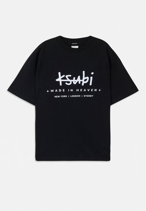 Black cotton t-shirt with a relaxed fit. Features white graphic text "ksubi" and "MADE IN HEAVEN" with city names below. Classic crew neck design.