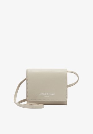Beige leather crossbody bag with a rectangular shape, embossed logo, and a thin strap. Smooth texture and minimalist design.