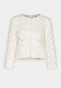 Vit broderad jacka med blommönster, långa ärmar och rund halsringning. Strukturerad genomskinlig tyg med knäppning framtill.