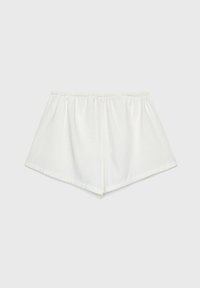 Shorts en coton blancs avec une taille élastique, présentant un design ample et léger avec un ourlet en angle pour un ajustement décontracté.