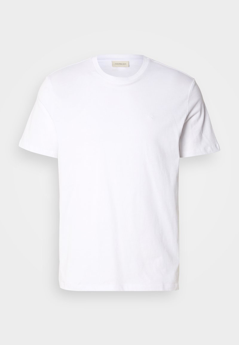 Biała koszulka z krótkim rękawem wykonana z miękkiej bawełny. Posiada okrągły dekolt oraz małe, dyskretne logo na piersi.