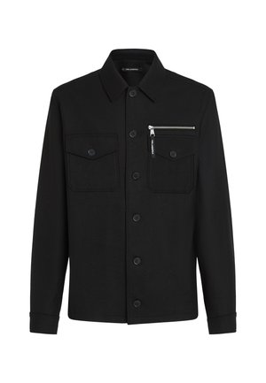 Black button-up jacket made of textured fabric, featuring two chest pockets and a zippered pocket on the left side, with a classic collar.