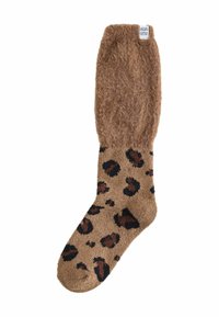 Braun-flauschige Socke mit einem Leopardenmuster auf einem cremefarbenen Grund. Weicher Stoff, knöchelhoch und mit einem gerippten Saum.