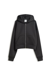 Sweat à capuche noir raccourci en molleton doux, avec une fermeture éclair frontale, de grandes poches avant et une capuche à cordon. Design épuré et minimaliste.