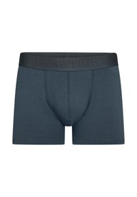 Bóxers para hombres en tela azul oscuro con una textura suave. Presentan una cinturilla elástica con marca y un diseño de bolsa contorneada.