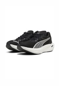 Black athletic shoes with a textured upper and white sole. Features include black laces and a silver Puma logo on the side.