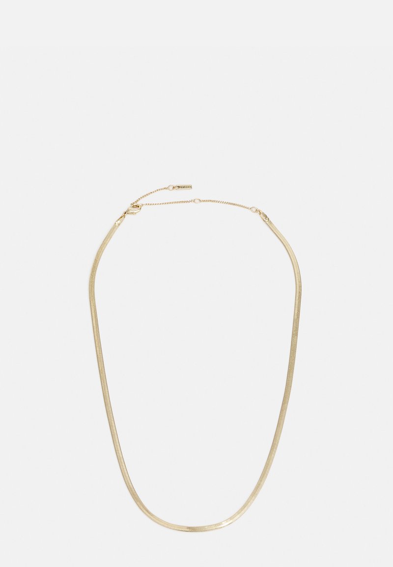 Gold-colored necklace with a sleek, curved design. Features a smooth texture and a clasp with an adjustable chain for sizing.