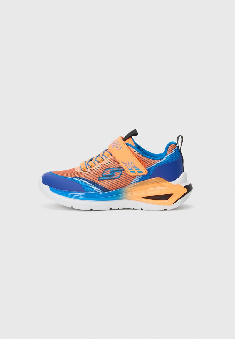 Bright orange and blue athletic sneaker with white sole, black pull tab, and orange Velcro strap fastening on plain background.