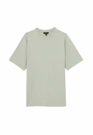 Tricou scurt cu mânecă scurtă de culoare verde deschis, realizat dintr-un material texturat, având guler rotund și o croială lejeră. Fără logo-uri sau modele vizibile.