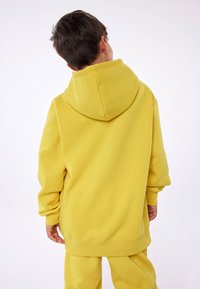 Champion EXCLUSIVE HOODIE UNISEX - Felpa - yellow