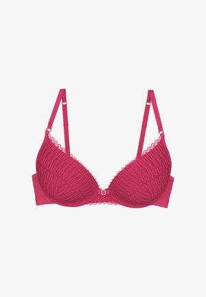 Roze kanten bh met een patroon en gladde cups, voorzien van verstelbare bandjes, beugel en een decoratieve strik in het midden.