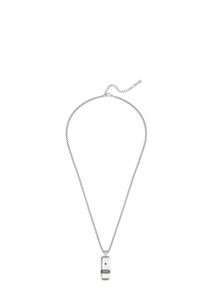 Silver chain necklace with rectangular pendant featuring black and white geometric design and small engraved brand logo.