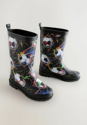 Svarta gummistövlar med ett färgglatt mönster av fotbollar, slät yta, texturerad sula och dragflikar upptill för enkel på- och avtagning.