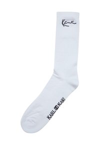 Hvide bomuldscrew-sokker med ribbet tekstur, sort "Kani" logo på kanten og "KARL KANI" trykt i sort nær tæerne.