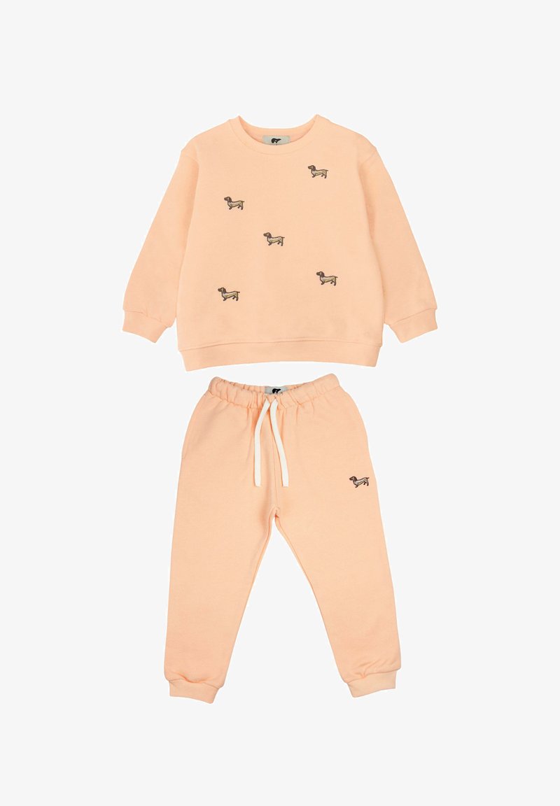 Pfirsichfarbene Sweatshirt- und Jogginghose, mit kleinen gestickten Hundemotiven, aus weichem Stoff, und elastischem Bund mit Kordelzug.