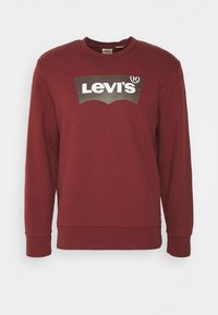 Sudadera granate de algodón, con un logo negro de Levi's en el pecho. Cuello y puños acanalados, con un corte recto.