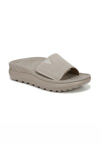 Sandalo con slide beige, dotato di una ampia cintura superiore e una soletta testurizzata. Presenta una suola spessa e sagomata con un motivo a zigzag per una migliore presa.