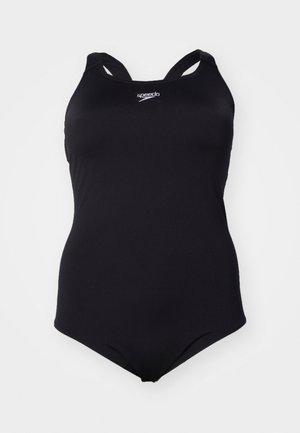 Maillot de bain une pièce noir en tissu extensible, avec un design dos nageur et le logo "Speedo" sur la poitrine. Texture lisse.