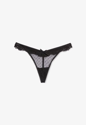 Zwarte kanten string met stippenmesh, geschulpte randen en een klein strikje aan de voorzijde van de tailleband.