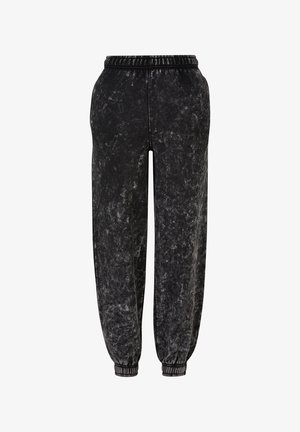 Čierne teplákové nohavice s textúrovaným, mierne mramorovaným povrchom. Obsahujú elastický pás a manžety pre tesné pohodlie.