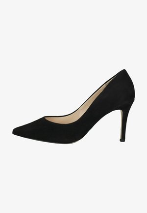Schwarze Wildleder-Pumps mit spitzer Zehenpartie, niedrigem Ausschnitt und schlankem Stiletto-Absatz. Glattes Innenleben mit kontrastierendem nude-farbenem Futter.