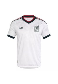 Maillot de football du Mexique à manches courtes blanches avec bordures noires et rouges, logo Adidas sur la poitrine droite et emblème du Mexique sur la poitrine gauche.