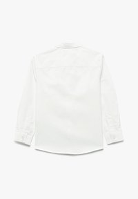 Witte langemouwende shirt met een button-down kraag, achterste yoke detail en knoopsluiting bij de manchetten. Gladde textuur, klassieke pasvorm en afgeronde zoom.