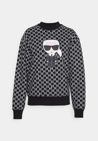 Schwarz-weißer Sweatshirt mit einem geometrischen Muster, das eine Cartoon-Grafik auf der Vorderseite zeigt, die eine Figur mit Sonnenbrille und Anzug darstellt.