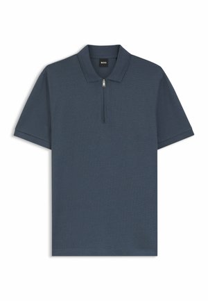 Polo blu scuro con mezza zip, maniche corte e tessuto strutturato. Presenta un colletto piegato e il logo del marchio sull'etichetta interna.