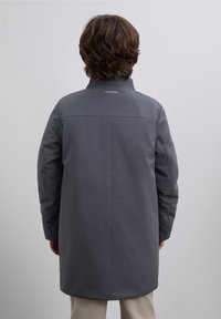 Gray coat made from smooth fabric, featuring a straight cut, high collar, and logo at the back. Plain design with no visible patterns.
