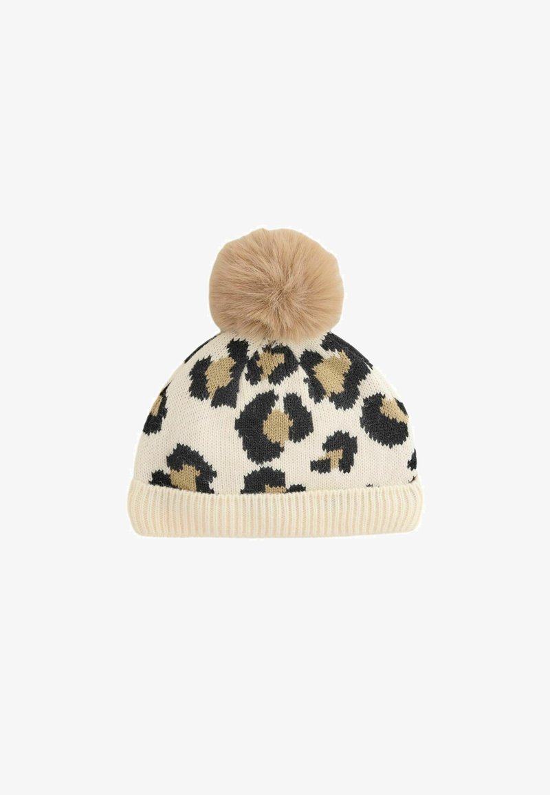 Pletená čepice s krémovým podkladem, zdobená černými a hnědými leopardími skvrnami, a huňatou hnědou bambulí nahoře. Ribovaný povrch na dně.