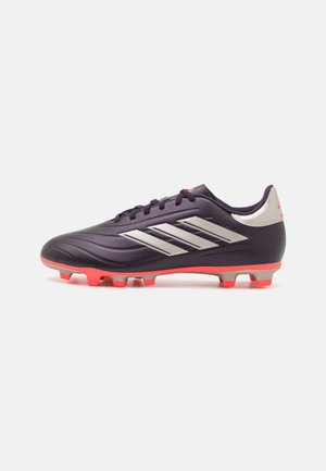 Purple synthetic soccer cleat featuring silver side stripes, a textured upper, and bright red studs for traction on grass surfaces.