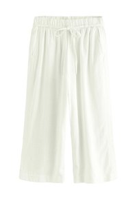 Fehér vászon culottok, rugalmas derékrésszel és állítható zsinórral, két oldalsó zsebbel és lazán, bő szabással.