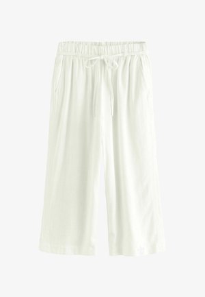 White linen culottes with an elastic waistband and adjustable drawstring, featuring two side pockets and a relaxed, loose fit.