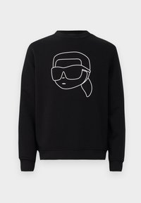 Felpa nera con un disegno lineare minimalista di un volto con occhiali da sole, scollo rotondo e polsini a coste.