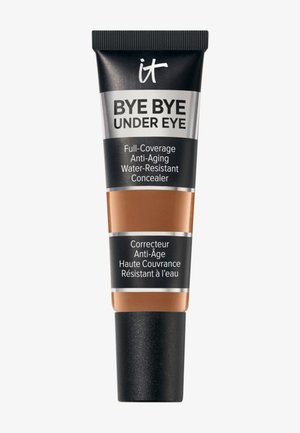 Tube of "it Bye Bye Under Eye" full-coverage, anti-aging, water-resistant concealer with black cap and multilingual text on black and brown packaging.