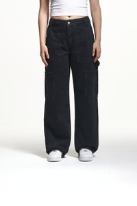 Black cargo pants with wide legs, featuring large front pockets and a high waist design. Made of denim with a smooth texture and contrasting stitching.