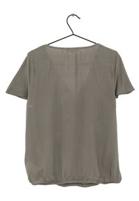 Short-sleeve top on a hanger, in a muted olive green fabric, featuring a rounded neckline, slightly gathered hem, and smooth texture.