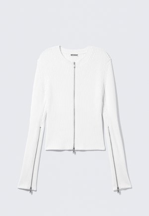 White ribbed knit jacket with a round neck, cropped design, and silver front and side zippers on long sleeves.