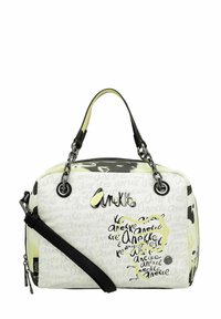 Sac à main synthétique noir et blanc avec un accent jaune, présentant un motif graphique et un logo, une quincaillerie métallique, et une sangle amovible.