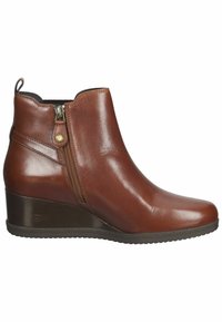 Bottine en cuir marron avec fermeture éclair latérale, petit talon compensé et languette à l'arrière, vue de côté extérieur.