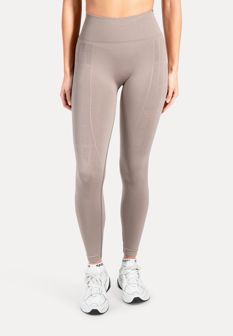 High-waisted leggings i lys taupe lavet af strækbart stof, med en ribbet linning og diskret logodetalje på siden.